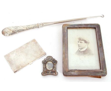 Mixed Lot: large Victorian handled button hook, London 1888, a silver photograph frame, Birmingham 1926, a silver plated card