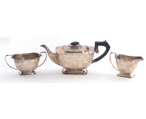 George VI silver three piece tea set of compressed rectangular form comprising tea pot, twin handled sucrier, milk jug, Birmi