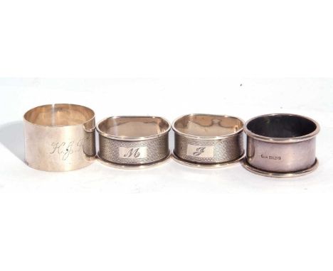 Pair of Elizabeth II D-shaped napkin rings with engine turned decoration, Birmingham 1988/9 and two other hallmarked examples
