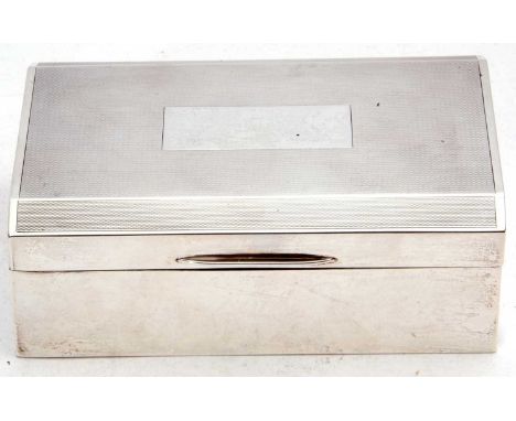 George VI silver table cigarette casket, engine turned decoration with a rectangular vacant cartouche, wood lined and loaded 