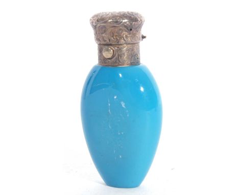 Victorian period blue milk glass scent bottle of flask shape, having hinged unmarked white metal lid, bearing traces of gildi