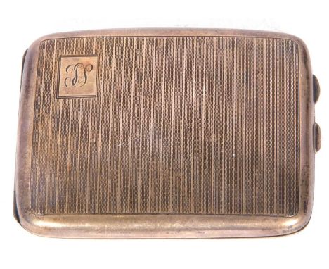 George V silver cigarette case of rectangular curved form, one corner engraved with a cartouche and monogram, an engine turne