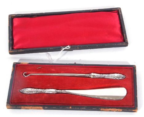 Victorian cased shoe horn and button hook, each with embossed silver handles, Birmingham 1897