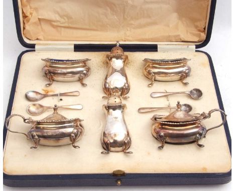 Cased 10-piece silver condiment set comprising two peppers, two mustards, two open salts and liners, together with four condi