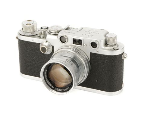 A Leica IIIf Black Dial Rangefinder Camera, 1951, chrome, serial no. 546557, with Leitz Summicron f/2 50mm lens, 1954, chrome