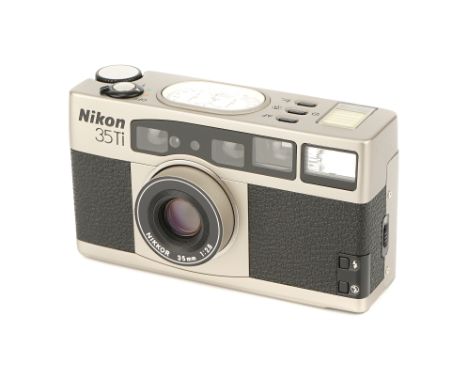 A Nikon 35Ti Compact Camera, 1993, titanium, serial no. 5011115, with Nikkor f/2.8 35mm lens, body, E, untested, lens, E, wit