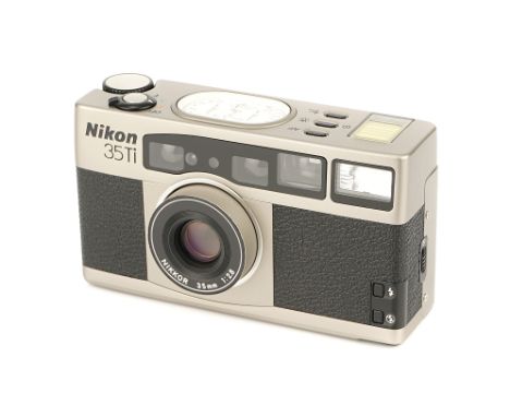 A Nikon 35Ti Compact Camera, 1993, titanium, serial no. 5007194, with Nikkor f/2.8 35mm lens, body, E, untested, lens, E, wit