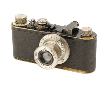 A Leica I Model C Camera, 1930, black, serial no. 27221, with Leitz Elmar f/3.5 50mm lens, nickel, body, G-VG, shutter workin