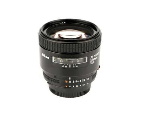 A Nikon AF Nikkor f/1.8 85mm Lens, black, serial no. 232769, body, E, elements, E, some very light internal haze, with paperw