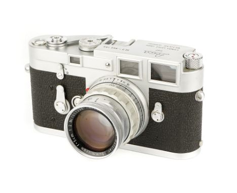A Leica M3 Rangefinder Camera, 1960, chrome, serial no. 966189, with Leitz Summicron f/2 50mm lens, 1957, chrome, serial no. 