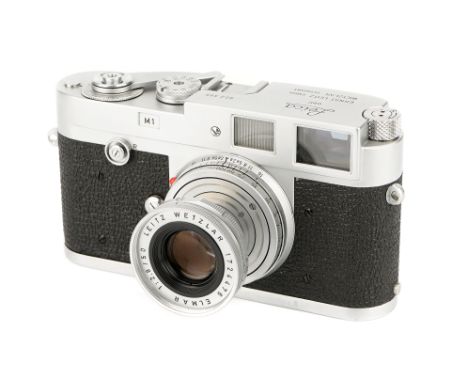 A Leica M1 Camera, 1959, chrome, serial no. 952395, with Leitz Elmar f/2.8 50mm lens, 1930, chrome, serial no. 1724476, body,