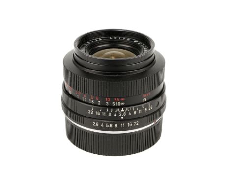 A Leitz Elmarit-R f/2.8 35mm Lens, 1964, black, serial no. 2034015, body, VG, elements, VG, complete with lens hood and maker