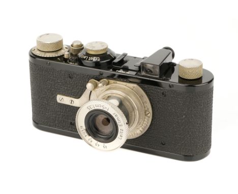 A Leica I Model A Camera, 1930, black, serial no. 25392, with Leitz Elmar f/3.5 50mm lens, nickel, body, VG-E, shutter workin