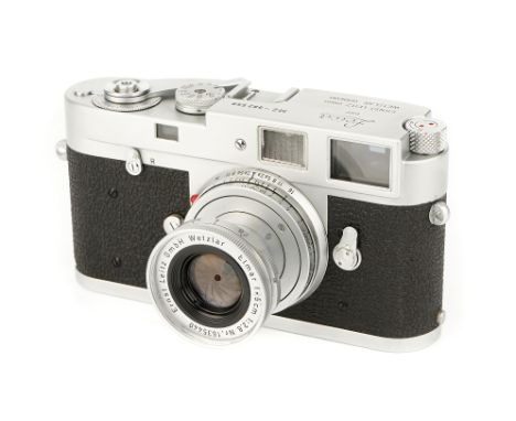 A Leica M2 Rangefinder Camera, 1959, chrome, serial no. 982558, with Leitz Elmar f/2.8 50mm lens, 1958, chrome, serial no. 16