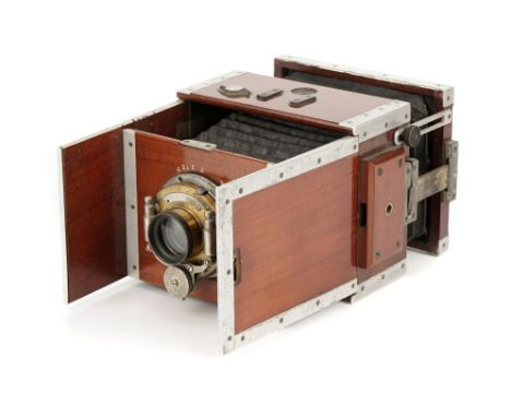 A Shew Aluminium Xit Camera, 1910, with unmarked brass lens, in Bausch &amp; Lomb shutter, body, G-VG, lens, VG, shutter stic