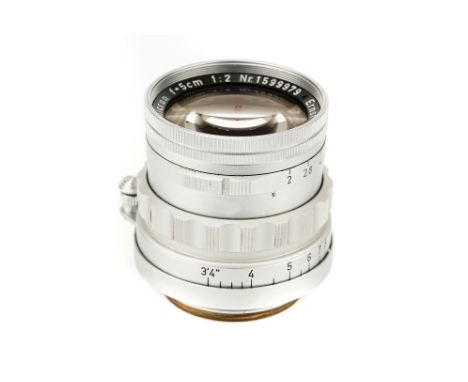 A Leitz Summicron f/2 50mm Lens, 1958, chrome, serial no.1599979, body, VG-E, elements, VG, some light internal haze, with ma