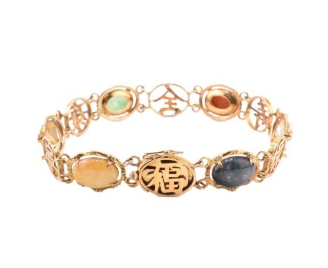 A 14ct gold and stone set Chinese stone set bracelet. The 14ct yellow gold panel bracelet set with oval jade and hard stone c