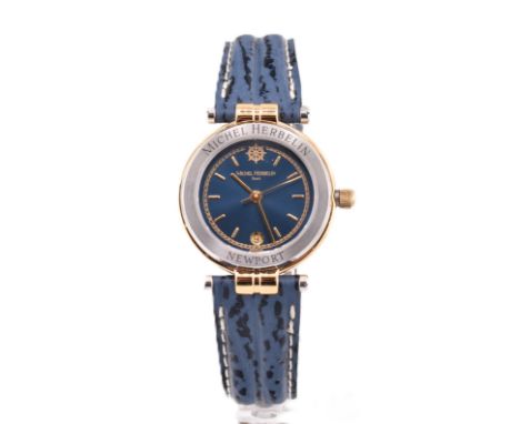 A ladies Michel Herbelin Paris Newport wristwatch. The watch in the original case with manual.

This model showcases a blue, 