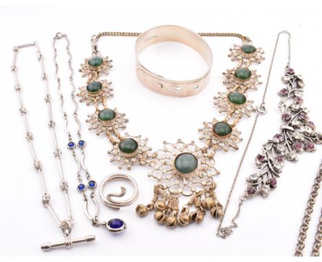 A collection of jewellery including a silver bangle. The jewellery to include an engraved bangle with belt hole fastener, sta