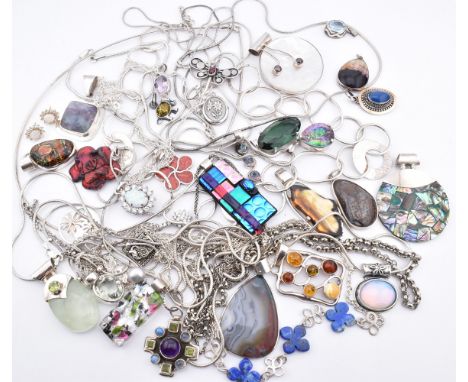 A quantity of 925 silver and white metal pendant necklaces including synthetic opal and cubic zirconia cluster pendant neckla