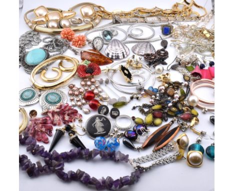 A large collection of costume and silver jewellery and wristwatches. The lot to include a silver and amber pendant necklace, 