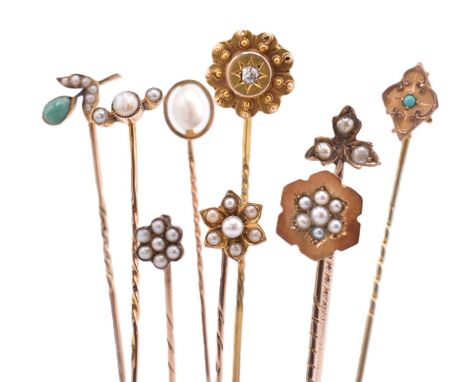 A collection of Victorian and later 9ct gold and gem set stick pins. The lot of nine 9ct gold stick pins to include pearl set