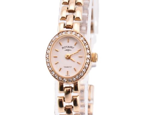 A hallmarked 9ct gold and diamond ladies Rotary cocktail watch. The wristwatch having quartz movement with a white dial with 