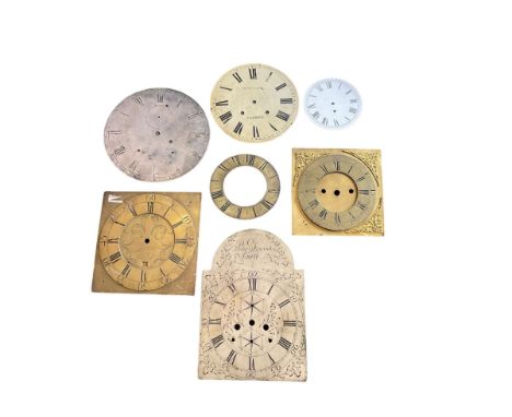 Six clock dials and an engraved brass chapter ring.Comprising of four 18th century brass longcase dials with two painted wall