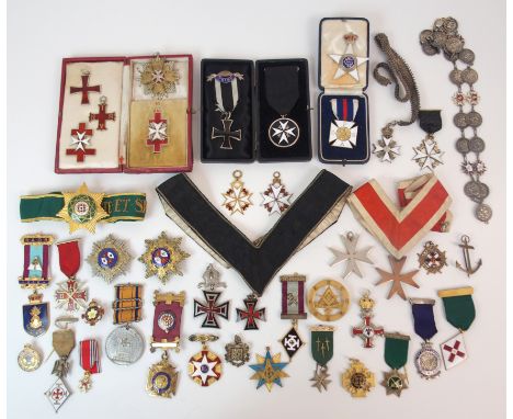 AN ORDER OF ST JOHN BREAST BADGE in black and white enamel with other Order of St. John medals and badges and a quantity of M