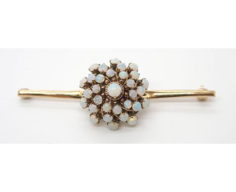 A 14K GOLD OPAL CLUSTER BAR BROOCH the opal cluster diameter is approx 2.1cm, length of the bar brooch 6.2cm, weight 5.7gms C