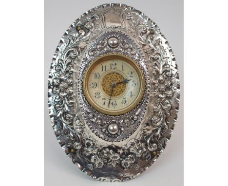 A VICTORIAN SILVER CASED STRUT CLOCK by Charles Edwards, London 1888, the white enamel dial with Roman numerals and central p