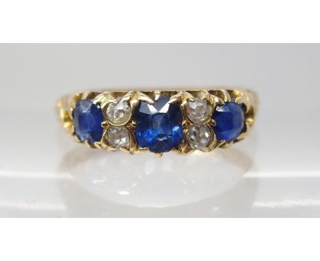 AN 18CT GOLD SAPPHIRE AND DIAMOND DRESS RING finger size M1/2, weight 3.7gms Condition Report: Zoning visible in the sapphire