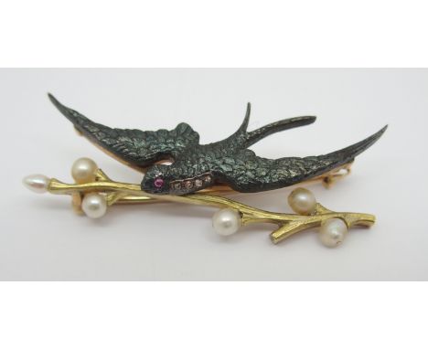 A BRIGHT YELLOW METAL DIAMOND, PEARL AND RUBY SWIFT BROOCH the swift bird fashioned in blued steel, with a ruby eye and diamo