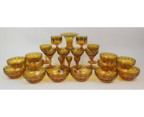 A SUITE OF AMBER FLASHED GLASSWARE with cut to clear decoration of grapes and vines and highlighted with green enamel, compri