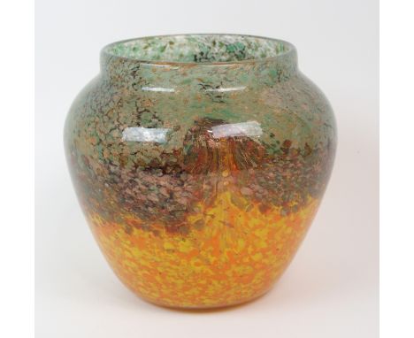 A MONART GLASS VASE the mottled orange, brown and green glass with aventurine inclusions, 17.5cm high, with remnants of paper