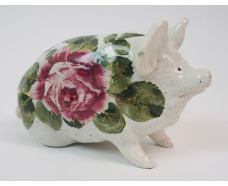 A WEMYSS WARE PIG glazed in white with cabbage roses, painted yellow Wemyss to base, 16cm long Condition Report: Light crazin