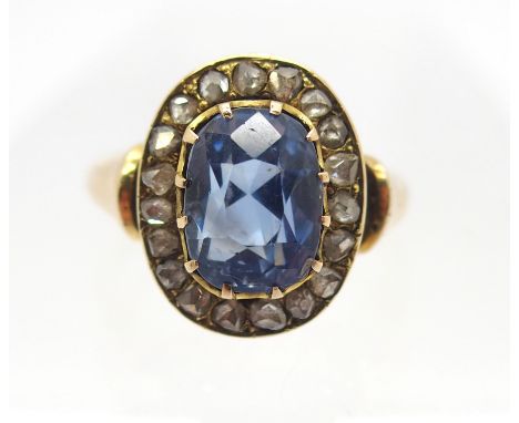 A BRIGHT YELLOW METAL SAPPHIRE AND ROSE CUT DIAMOND RING sapphire approx 9.8mm x 7.2mm x 7.9mm. Finger size N, weight 6.5gms 