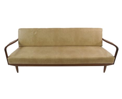 A GREAVES AND THOMAS TEAK FRAMED SOFA BED with shaped arms, covered in beige vinyl, 70cm high x 205cm wide x 85cm deep Condit