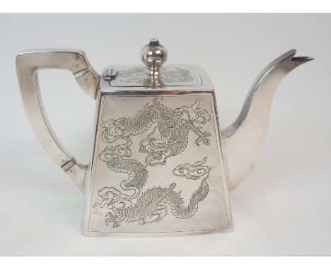 A CHINESE SILVER SQUARE TAPERING TEAPOT with hinged cover, two sides and the cover decorated with scrolling dragons, stamped 