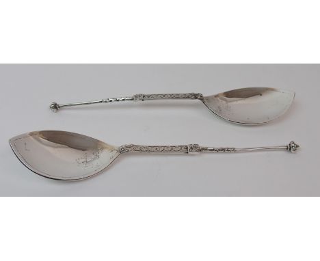 A PAIR OF SILVER SERVING SPOONS by Alexander Ritchie marked Iona AR and Glasgow 1929, the spearpoint bowls with Celtic decora