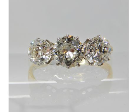 AN 18CT GOLD THREE STONE DIAMOND RING the three diamonds are estimate approx combined 1.65cts, finger size P, weight 2.5gms C