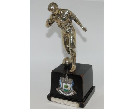 A WHITE-METAL FOOTBALL TROPHY MODELLED AS A FOOTBALLER on square wooden base with white-metal and enamel Glasgow coat-of-arms