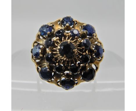 A 14CT GOLD SAPPHIRE CLUSTER RING with spiral design basket mount, head diameter 19.3gms, finger size Q, weight 4.2gms Condit