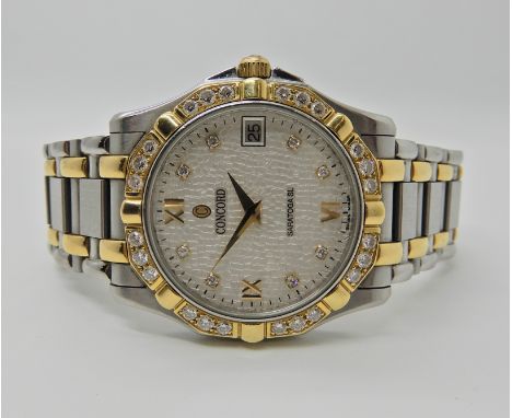 A GENTS CONCORD SARATOGA SL WRISTWATCH in gold and stainless steel with diamond set bezel and numeral dots, with further Roma