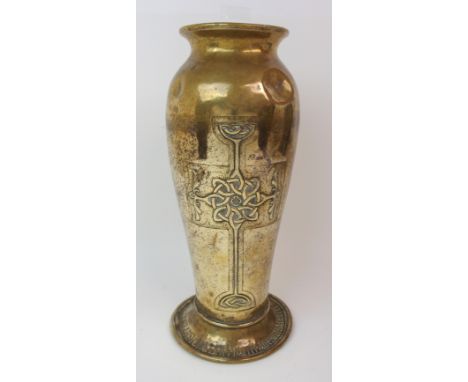 AN ALEXANDER RITCHIE BRASS VASE of tapering form and embossed with a Celtic knotwork cross to both sides, dated 1933 and R.E.