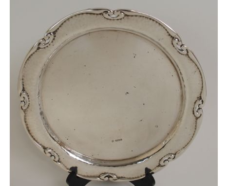 A SILVER SALVER by William Hutton Sons Limited, Sheffield 1907, of circular form with hammered silver outer edge with pierced