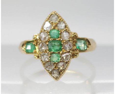 AN 18CT GOLD EMERALD AND ROSE CUT DIAMOND RING in marquis shape, finger size approx G1/2, weight 3gms Condition Report: Emera