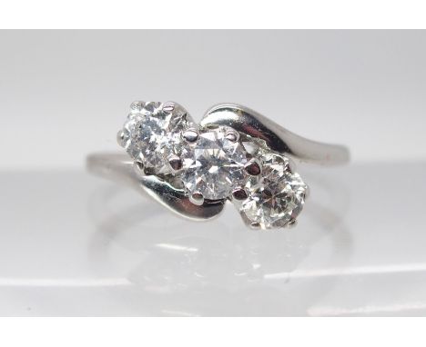 AN 18CT WHITE GOLD THREE STONE DIAMOND RING the three diamonds are estimated approx at just over 0.33cts with a combined tota