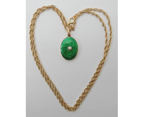 A YELLOW METAL GUILLOCHE ENAMEL AND PEARL PENDANT with locket back, dimensions 2.8cm x 1.5cm, with a 14k gold rope chain leng