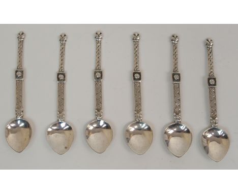 A CASED SET OF SIX SILVER SALT SPOONS by Alexander Ritchie, Glasgow 1928, the spearpoint bowls with stepped stems with Celtic